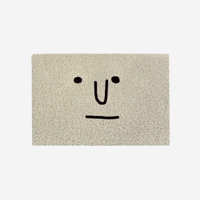 Szara zabawna wycieraczka z twarzą