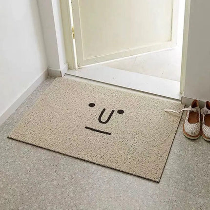 Szara zabawna wycieraczka z twarzą