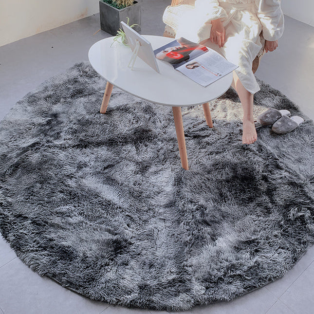 Okrągły puszysty dywan shaggy jasnoszary