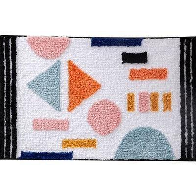 Biały chłonny dywanik łazienkowy geometryczny