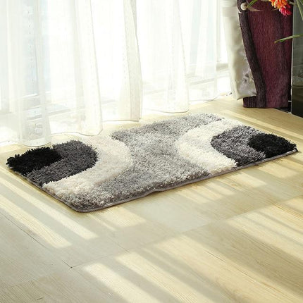 Szaro-czarny dywanik łazienkowy w fale