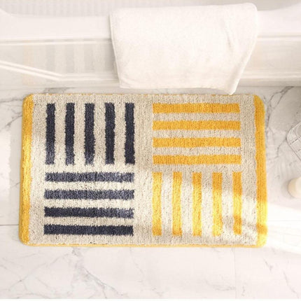 Miękki żółty dywanik łazienkowy pasy